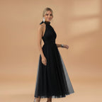 Women's maxi dress with a halter neck and tulle surface